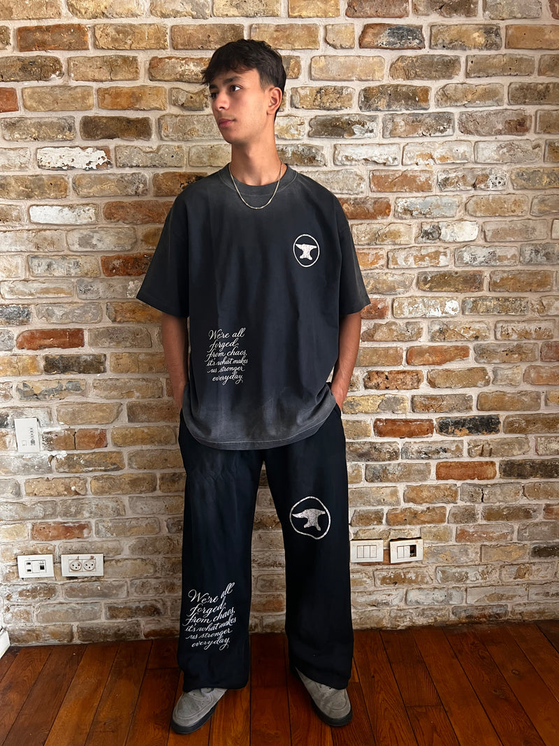 BLACK "CHAOS CREATES" BAGGY SUNFADED PANTS